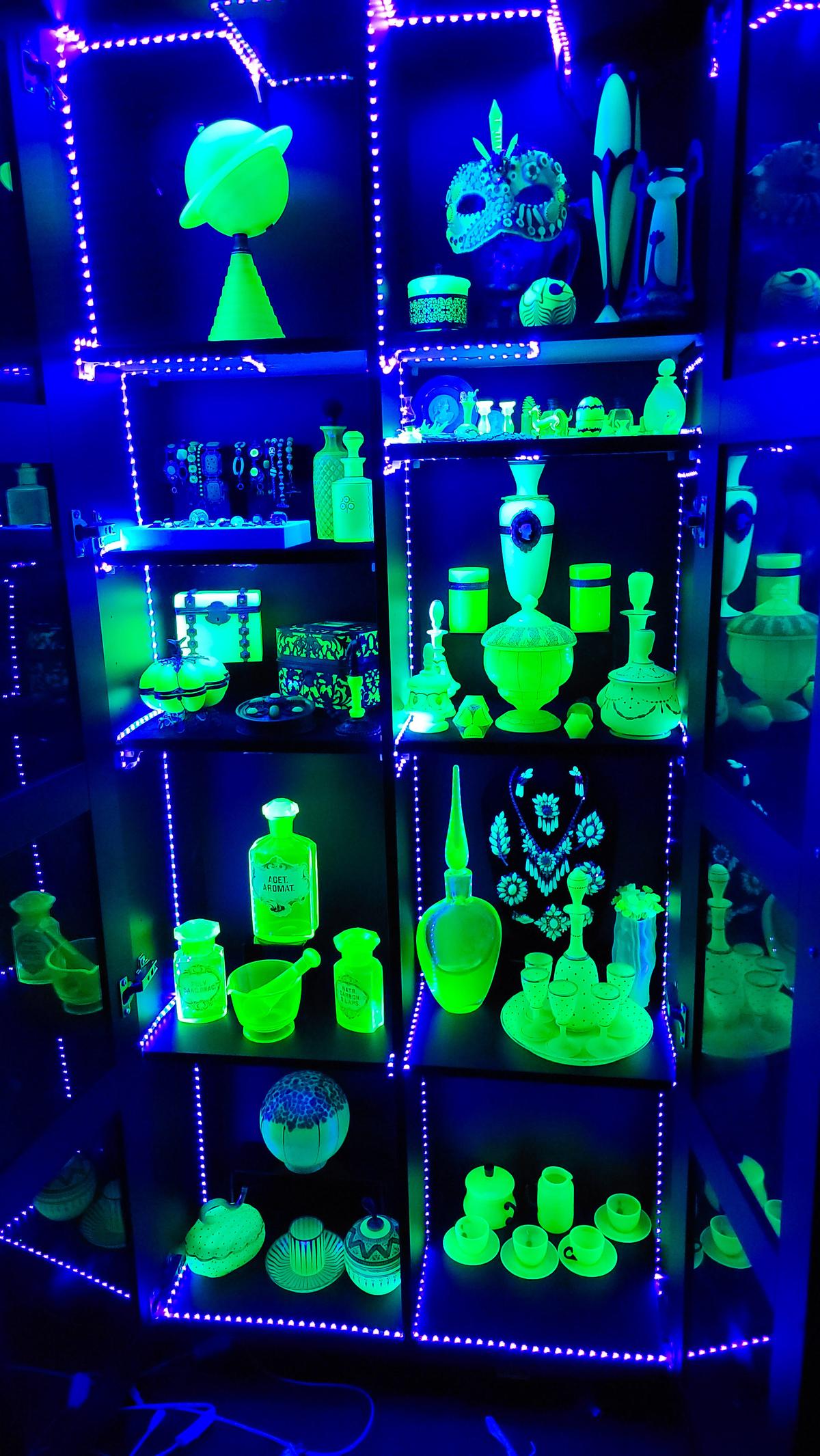 Whitney’s uranium glass jewelry cabinet, glowing